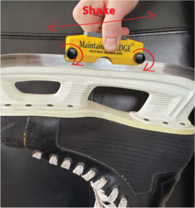 3/8 hockey ice skate sharpener on skate view showing tighten and movement.